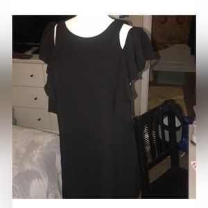 Short black cocktail dress with split sleeves